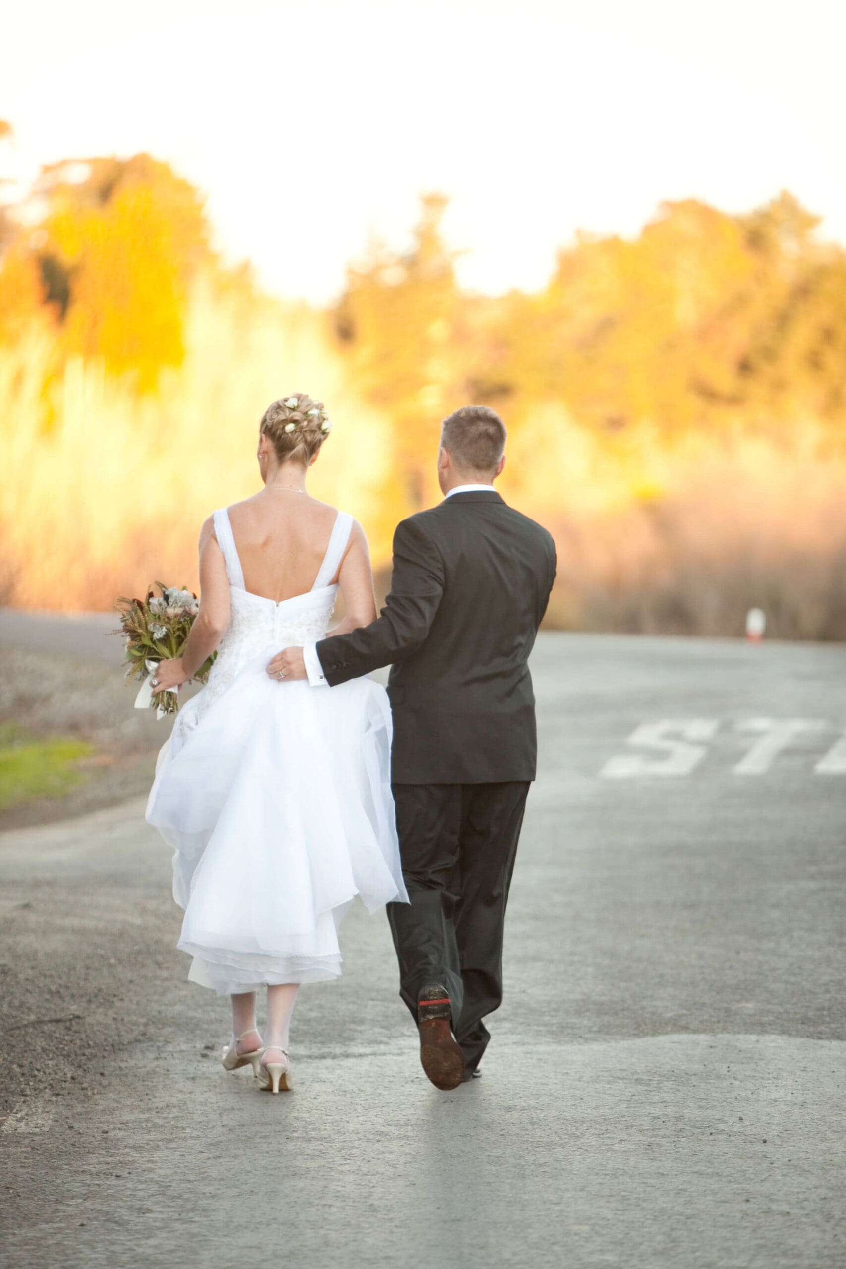 Wedding day memory – Phillipa Leseberg and her late husband Eric walking hand in hand, a love story beyond borders. A moment of love, commitment, and resilience, captured forever. Read more about their journey, love affair interrupted, and the memoir His Name is Eric at PhillipaLeseberg.com.