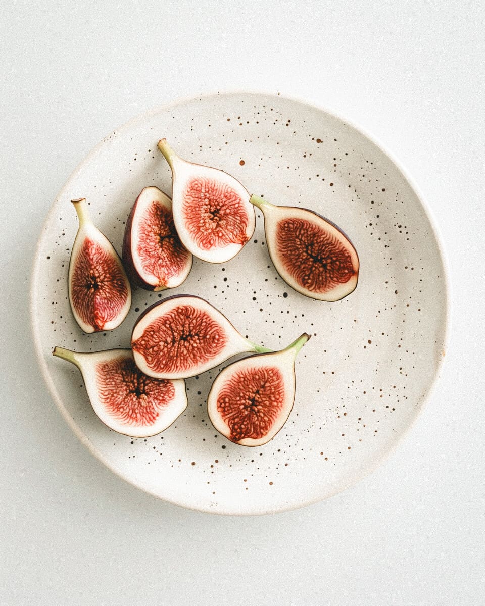 Fresh figs on ceramic plate – whole food nutrition, organic eating, and healthy lifestyle inspiration. Discover mindful eating, clean food choices, and holistic wellness at PhillipaLeseberg.com. Explore Phillipa Leseberg’s book His Name is Eric for more on food, health, and personal growth.